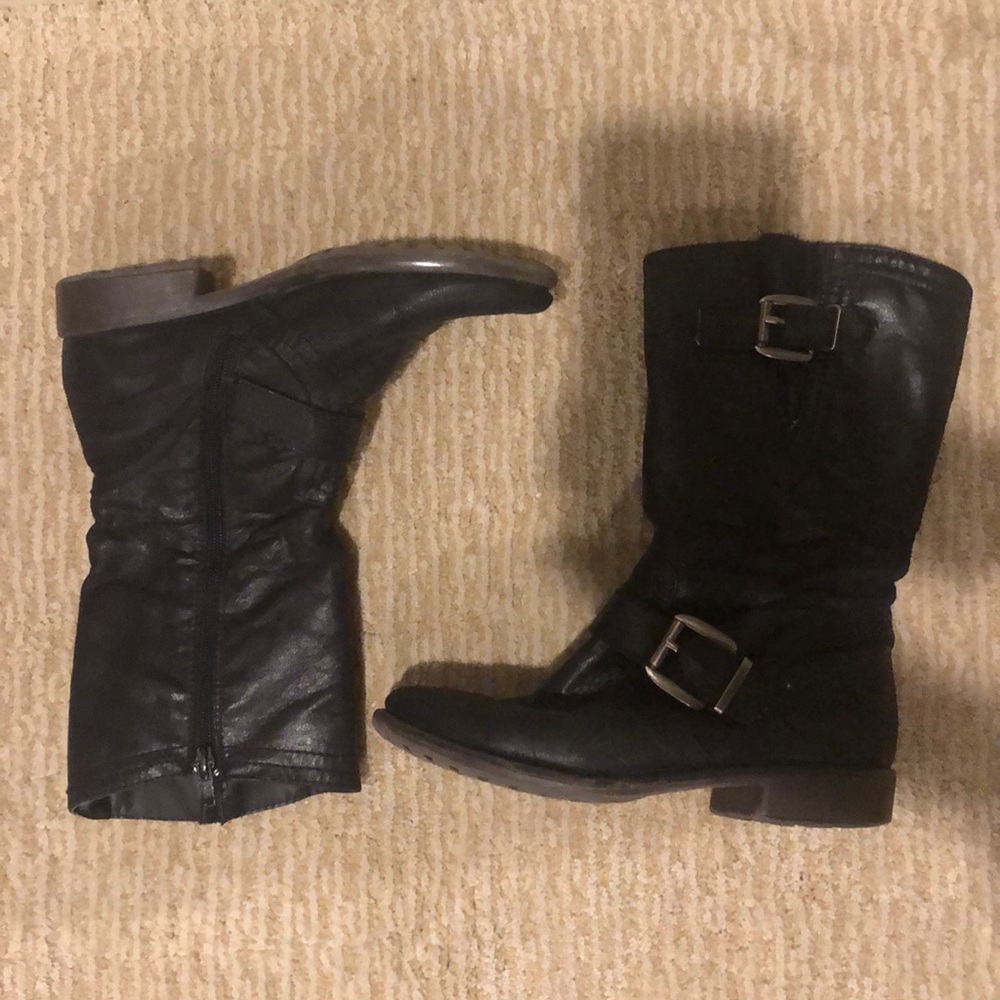 Black bare trap calf-high boots with side zipper.